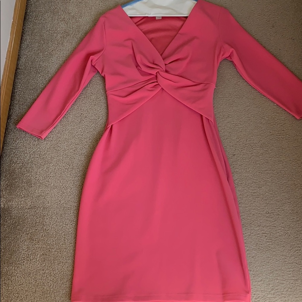 Pink fitted dress with front knot detail.